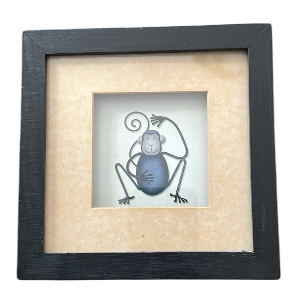 Framed monkey print.